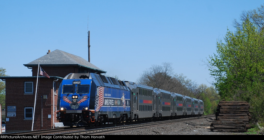NJT 4502 leads westbound NJT Train 5123 past ex-CNJ BOYD Tower
